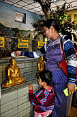 Women praying at Mahamuni Paya, Myanmar 